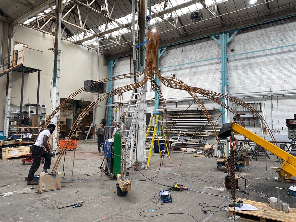 The "Hands Off Mangrove" sculpture being assembled